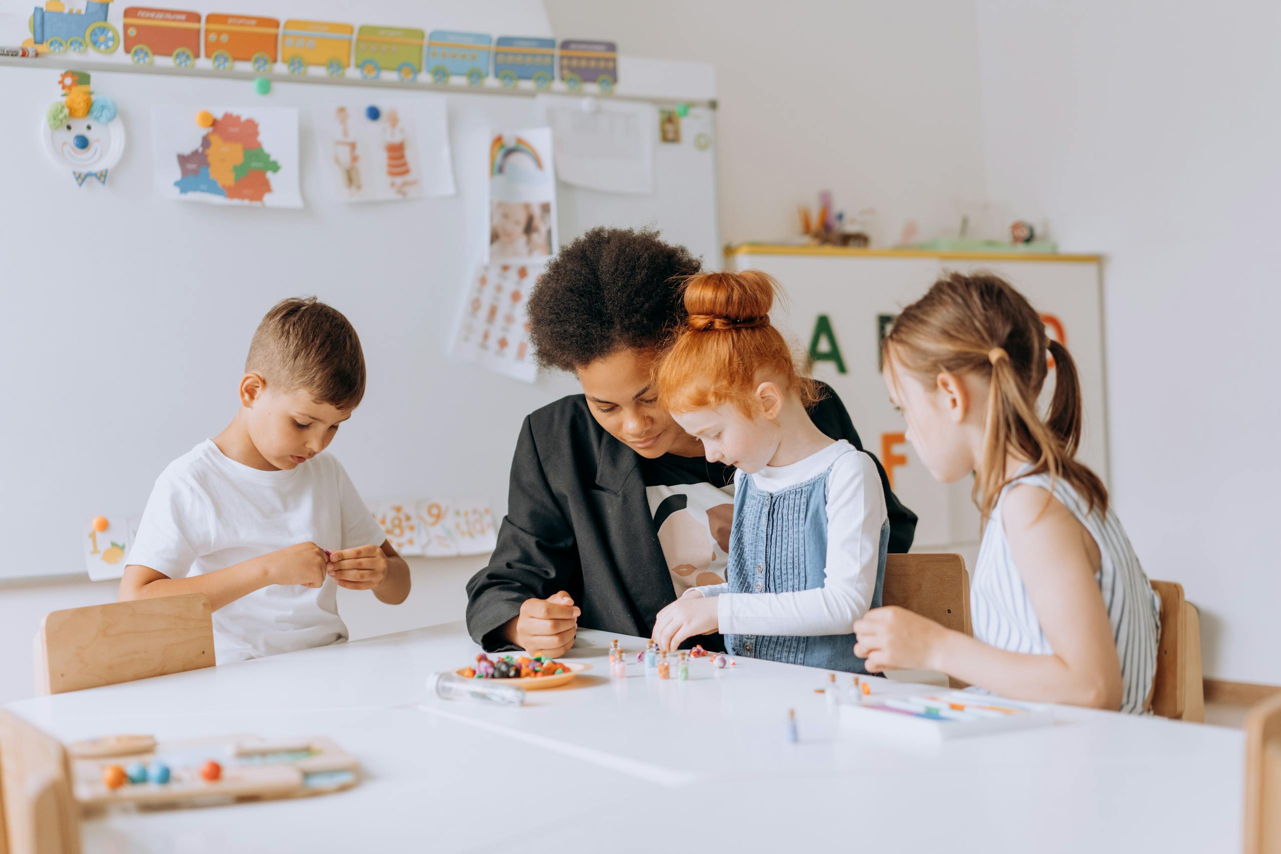 Industries 2 Early Childhood Education | Zesty Business Essentials. A group of children studying and playing in a diverse and inclusive classroom setting.